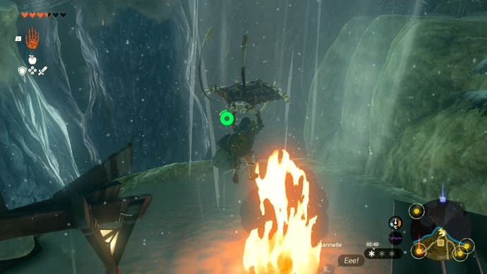 Link gliding over a fire to head towards the Rito Village in The Legend of Zelda: Tears of the Kingdom.