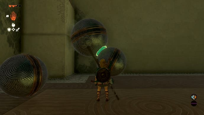 Link fusing two metal balls together as part of a puzzle in the Iun-orok Shrine.