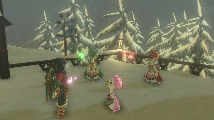 Link standing next to some cute, bird-like characters at the Rito Village location in The Legend of Zelda: Tears of the Kingdom.