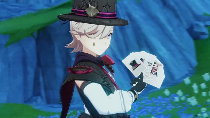 Lyney holding a few cards up.