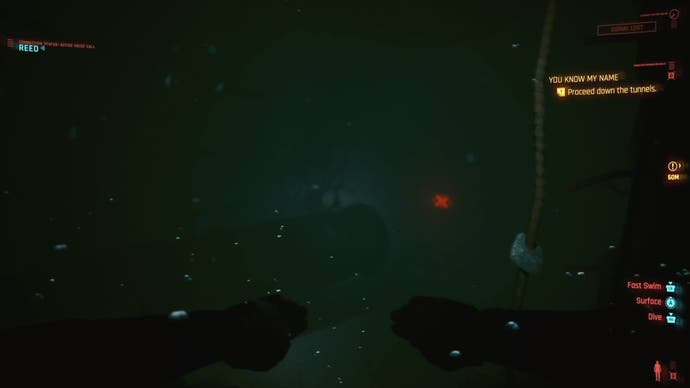 first person view of swimming underwater with a red mine in the distance