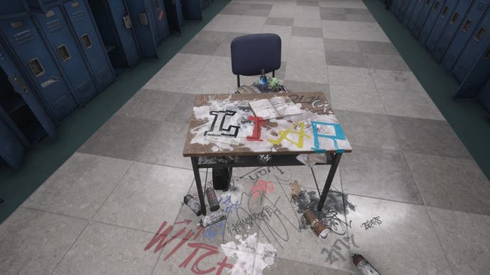 A desk in the middle of a hallway of lockers in a school, with the word 