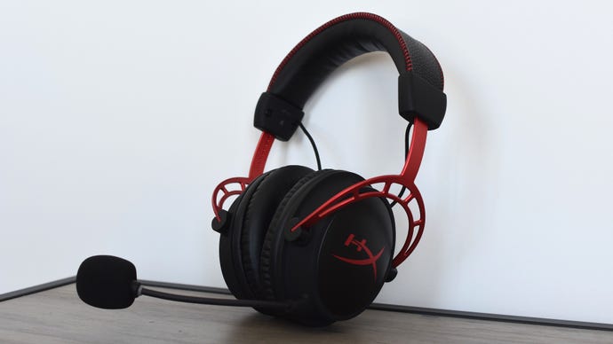The HyperX Cloud Alpha Wireless gaming headset propped up against a wall.