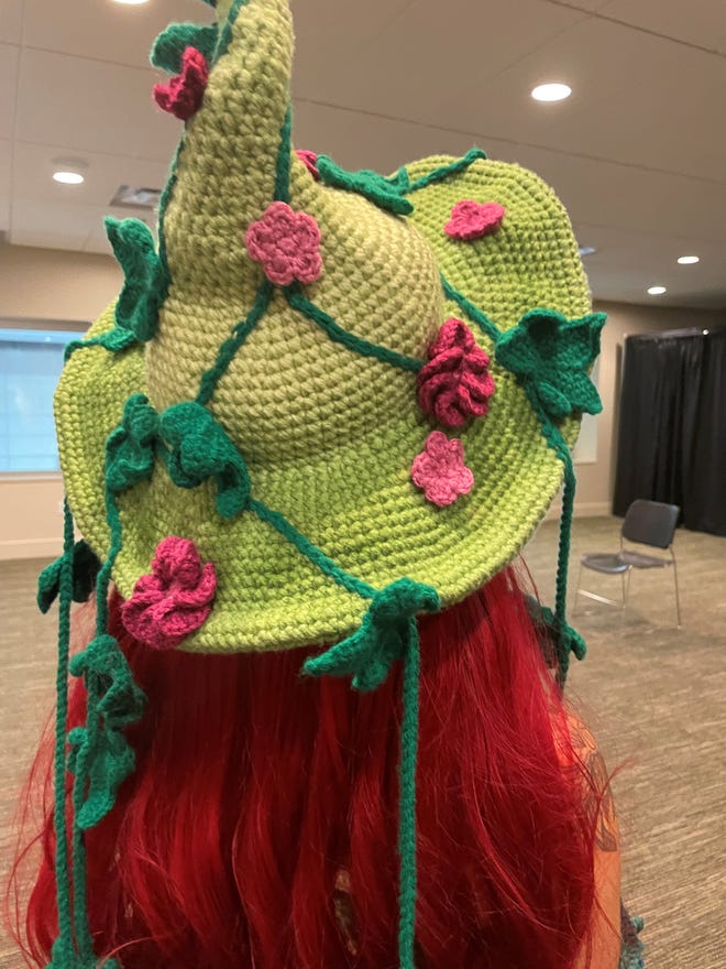 Jae's crocheted hat, from the back featuirng ivy and flowers