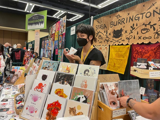 Image of artist holding washi tape behind their section display