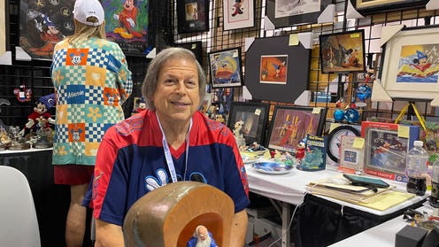 Photograph of Steve Waldman in his booth at D23