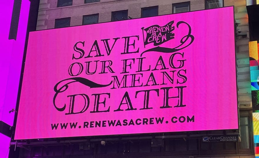 Photograph of pink billboard that reads Save Our Flag Mans Death and www.renewasacrew.com