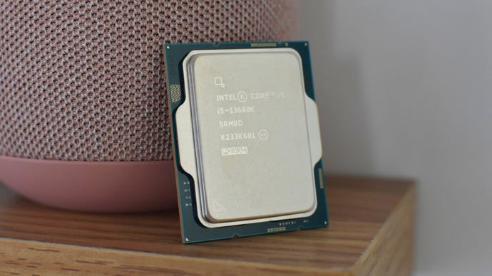 An Intel Core i5-13600K CPU propped up on a shelf.