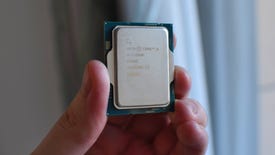 An Intel Core i5-13600K CPU being held up.