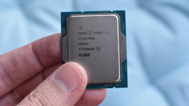 A hand holding an Intel Core i7-14700K CPU.