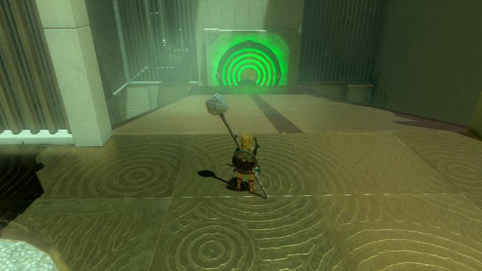 Link standing near a glowing, green panel that is about to reveal a doorway in the Iun-orok Shrine.
