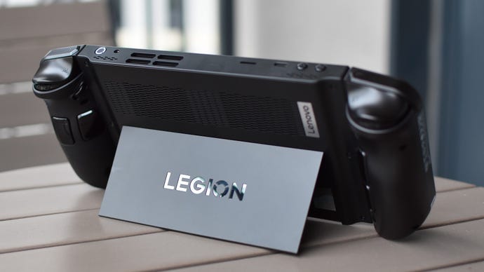 The Lenovo Legion Go resting on its table with its kickstand extended.