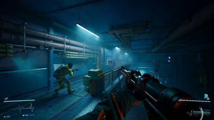 Players hide behind crates in the hallway while aiming their guns at Level Zero