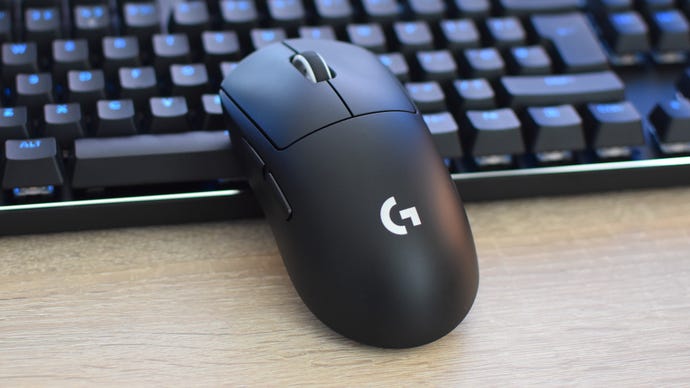 The Logitech G Pro X Superlight 2 gaming mouse leaning against a keyboard.