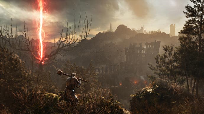 Lords of the Fallen promo screenshot showing a sweeping vista of distant hill with a pillar of red energy to the left