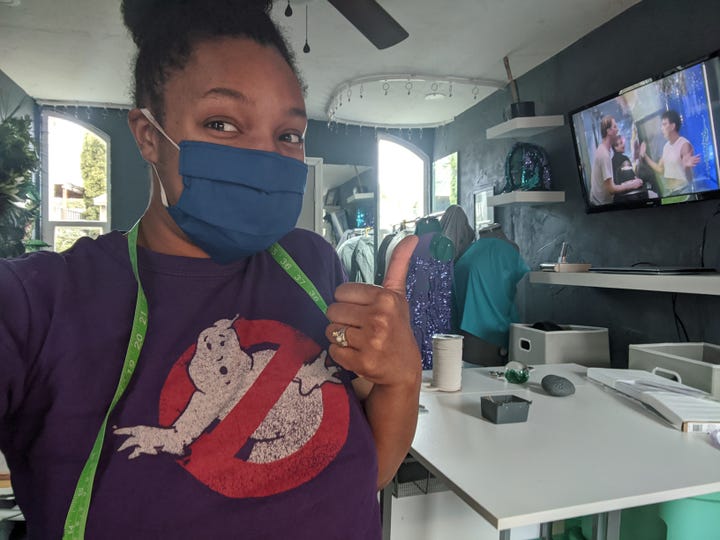 Sew Twisted Designs sewing masks inside her new craft studio.