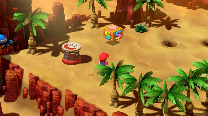 Mario is in the desert in this screen from Super Mario RPG. There is a border made of palm trees, a save block, a bounce-pad and a couple of sand whirlpools ahead of him.