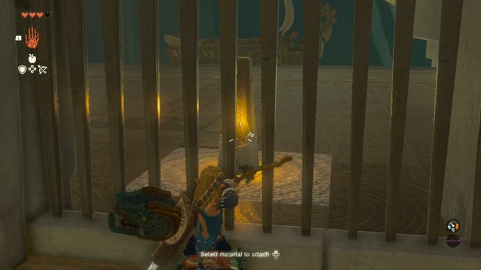 Link aiming at a yellow switch that's behind bars with his bow and arrow in The Legend of Zelda: Tears of the Kingdom.