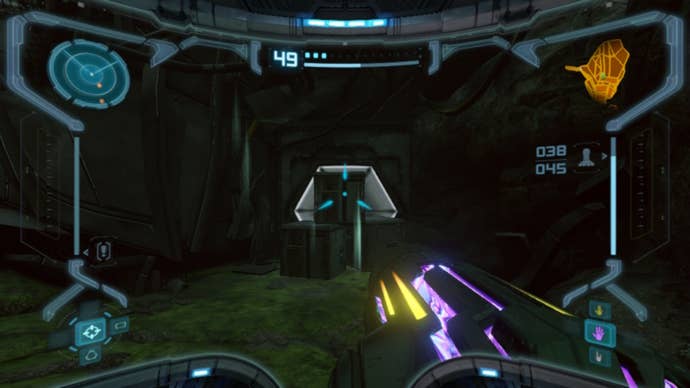 Samus aims at a door blocked by crates in Metroid Prime Remastered
