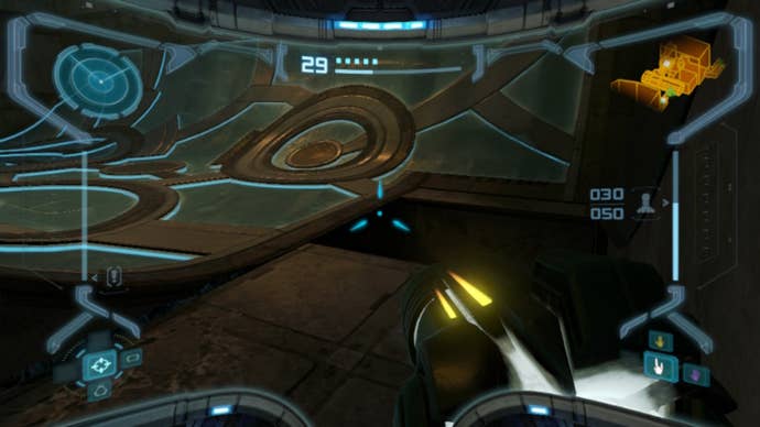 Samus aims at a bombable drain in Metroid Prime Remastered, which reveals an energy tank
