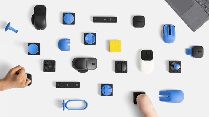 A collection of Microsoft Adaptive Accessories and their custom attachments, laid our neatly on a white table.