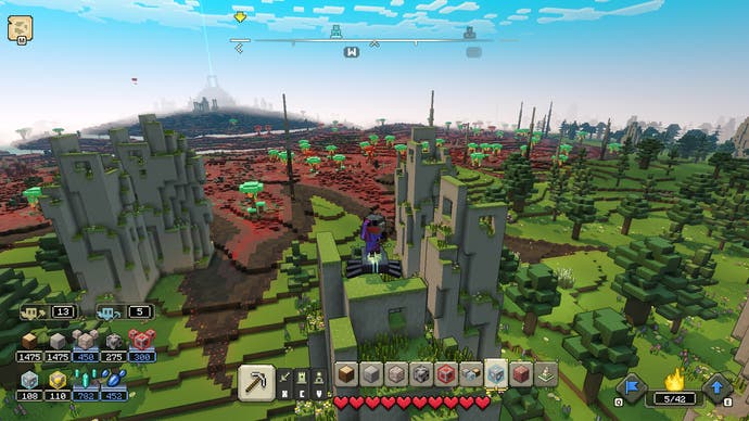 Minecraft Legends review - screenshot from Minecraft Legends, a high camera angle of some stone structures in green hills