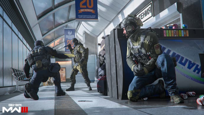 soldiers crouching in an airport walkway inside