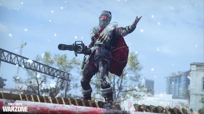 a gaunt looking man in a dirty santa costume holding a large gun with his other hand raised in the air while standing on top of a train in the snow