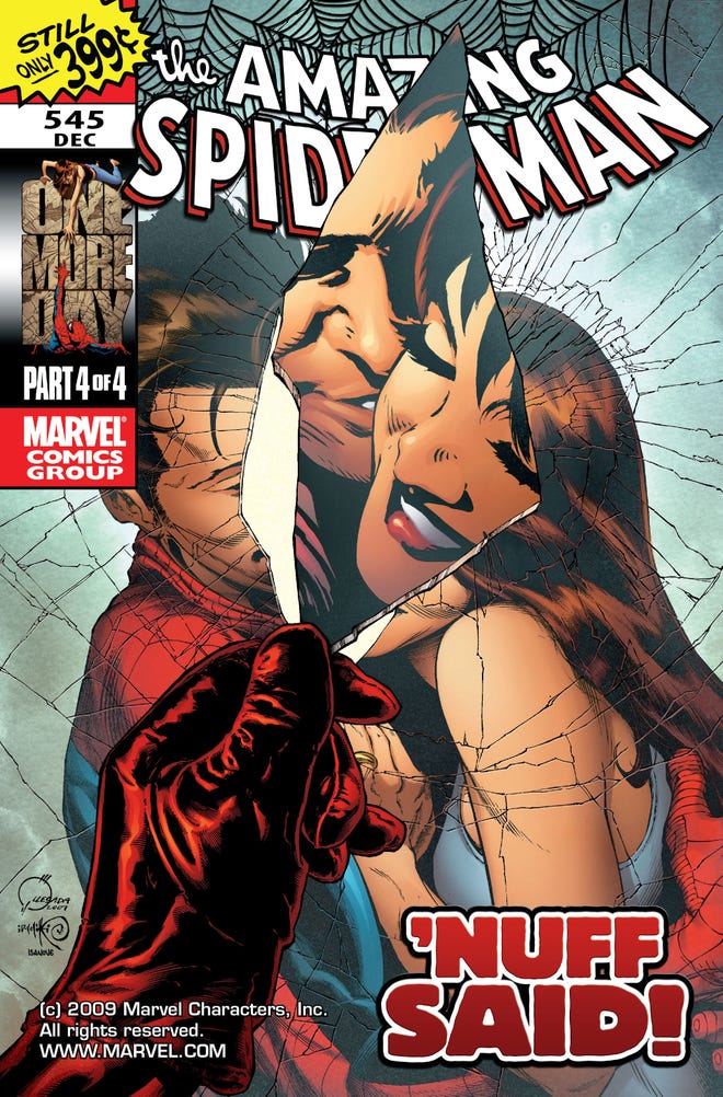 Cover of One More Day featuring a hand tearing an image of Peter Parker and Mary Jane