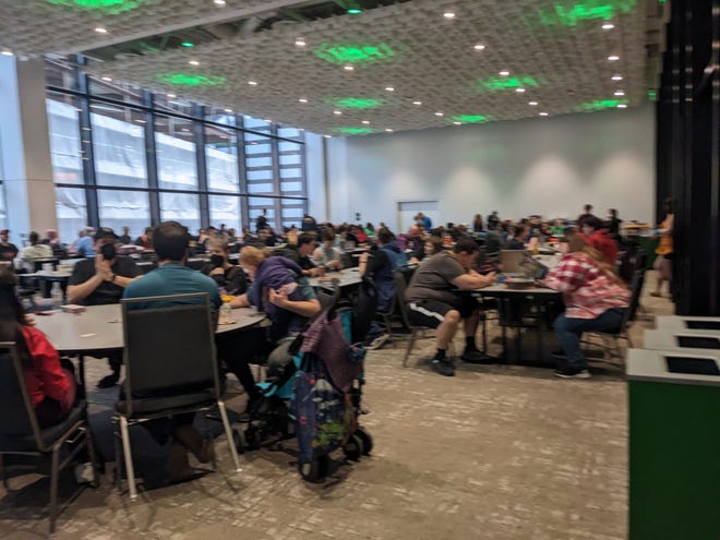 Photograph of people playing Role Playing Games in a large room