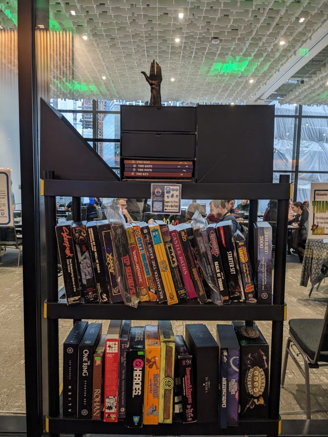 Photograph of a bookshelf featuring games