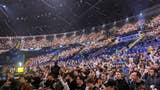 a crowd of Counter-Strike fans lit up by spotlights in the Spodek arena at IEM Katowice 2024