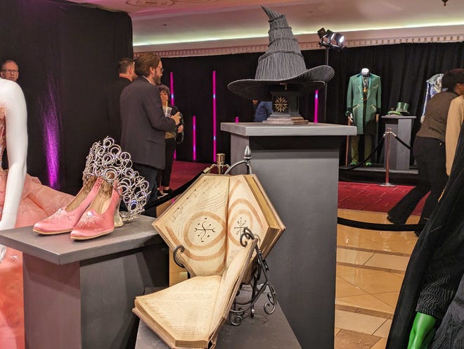 Photograph of props and costumes from Wicked on display