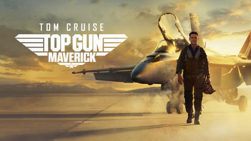 Promotional image for Top gun Maverick featuring Tom Cruise walking in front of a fighter jet