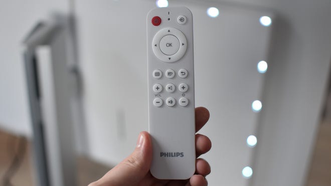 The remote control for the Philips Evnia 42M2N8900 gaming monitor.