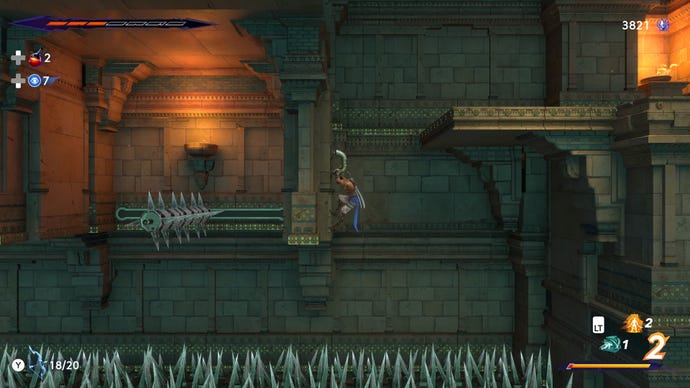 Sargon hangs from a ledge above a pit of spikes in Prince Of Persia: The Lost Crown
