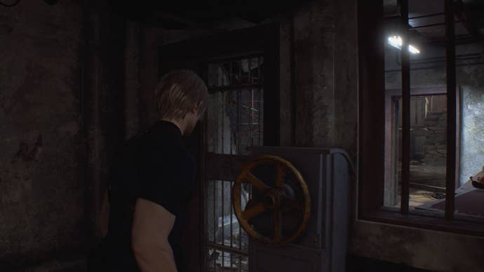 Leon turns a wheel to open a nearby gate in Resident Evil 4 Remake