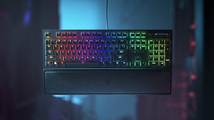 The Razer BlackWidow V3 keyboard against a dark sci-fi background.