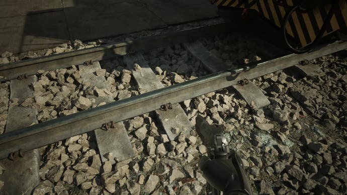 robocop: اسکرین شات شهر سرکش که نانیت و vsm را نشان می‌دهد که محیطی طبیعی با سنگریزه‌های زیر ریل راه‌آهن تولید می‌کند.