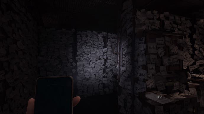 Silent Hill The Short Message Screenshot. The light from a mobile phone shows a room covered in sticky notes, all daubed with crude insults: stupid, loser, insane, ugly, creep, dumb etc.