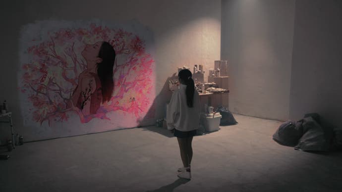 Silent Hill The Short Message Screenshot. In full-motion video, a Japanese girl stares at a huge pink and white mural that depicts a dark-haired girl surrounded by cherry blossom.