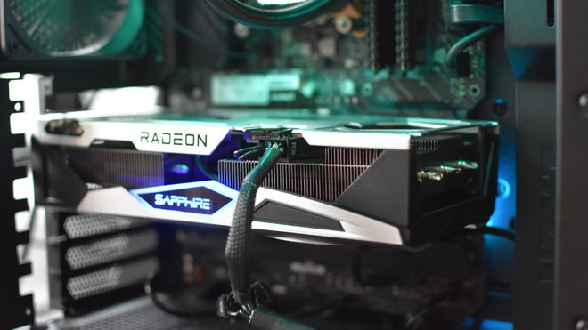 A Sapphire Nitro+ Radeon RX 6650 XT graphics card, installed and running in a gaming PC.