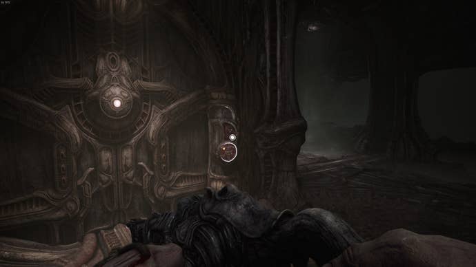 The player faces a door in Act 2 of Scorn