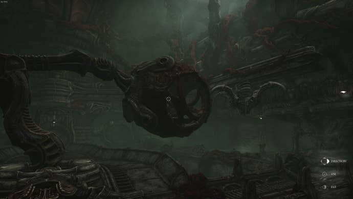A bloodied cube is suspended in the air by a machine in Act 3 of Scorn