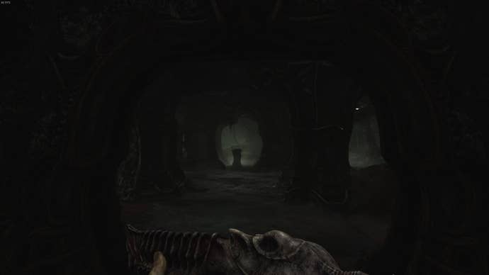 The player looks at a two-handed pillar in the distance in Act 3 of Scorn