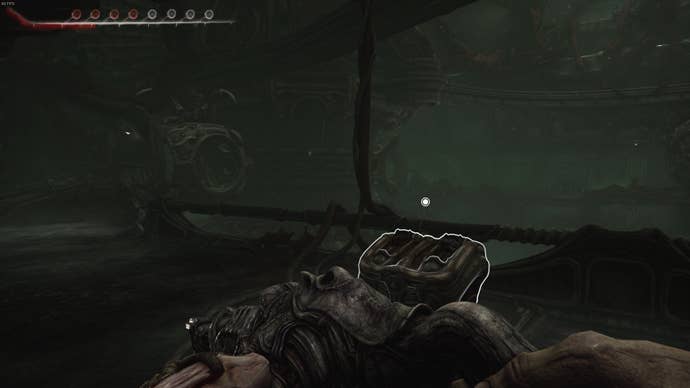 The player faces a two-handed pillar that is used to move a cube in Act 3 of Scorn