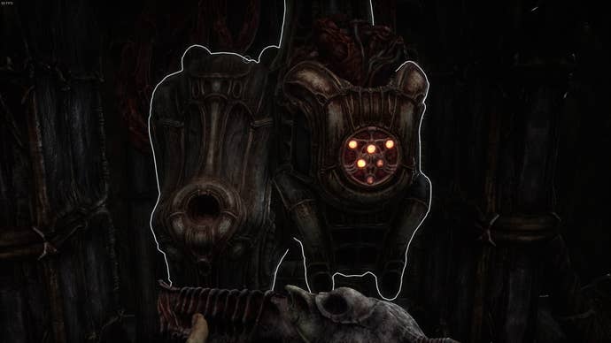 The player faces the key upgrading machine in Act 4 of Scorn