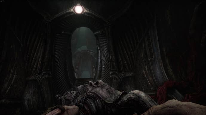 The player faces an archway leading to another one of the alien's bulging masses in Act 4 of Scorn