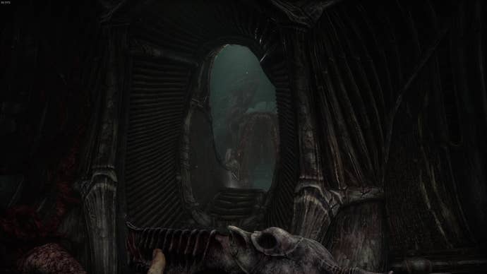 The player faces an archway leading to another one of the alien's bulging masses in Act 4 of Scorn