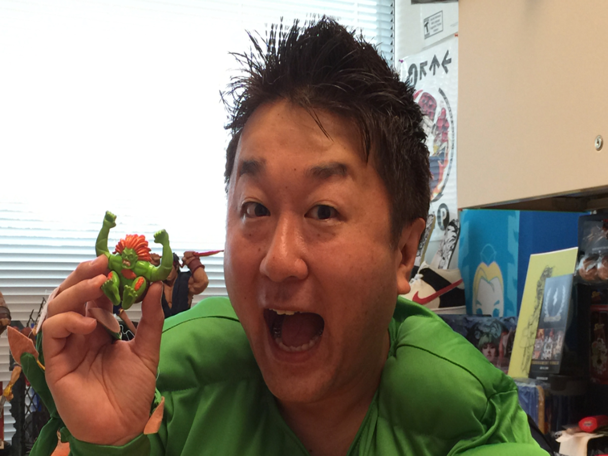 Yoshinori Ono tells the origin story of his Blanka toy that came from a  burger place in the Philippines revealing he wasn't a fan of the green  fighter
